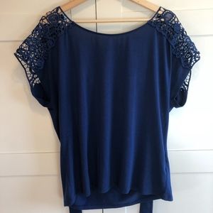 Blue t-shirt, with lace detail and tie back